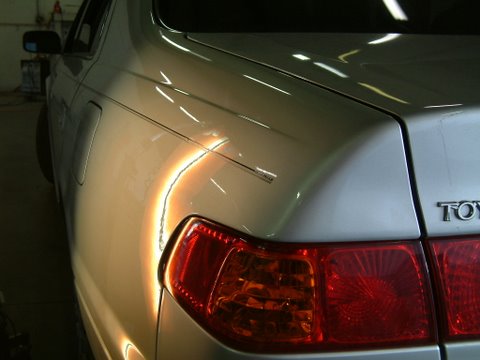 Paintless Dent Removal on Camry Quarter after