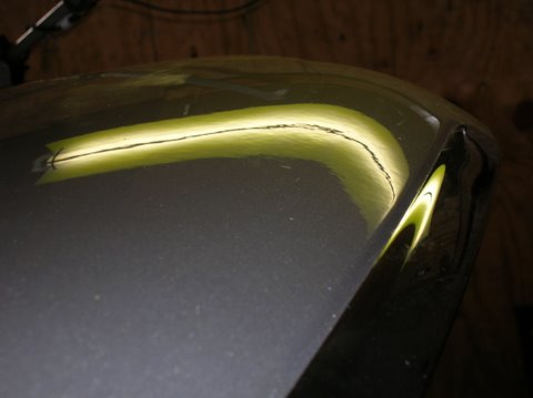 After paintless dent removal on the hood of a Hyndai Sonata