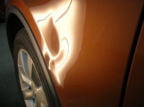Dent in Infiniti Fender Before repair second view