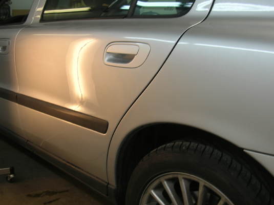 After paintless dent repair on Volvo S50 door view 2